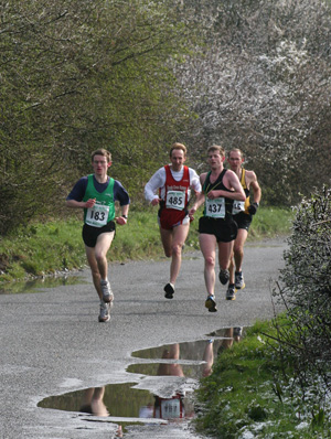 Owain Bristow leading the pack on the approach to railway bridge on the way to Denchworth.