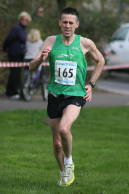 John Peake closing in on 19th place at the finish of the 28th White Horse Half Marathon held on Sunday, 11 April 2010 in Grove, Oxfordshire.