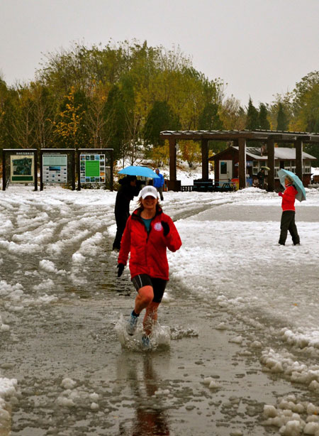 Jan McCabe running through the snow and ice on the 5km loop in Choayong Park, Beijing.